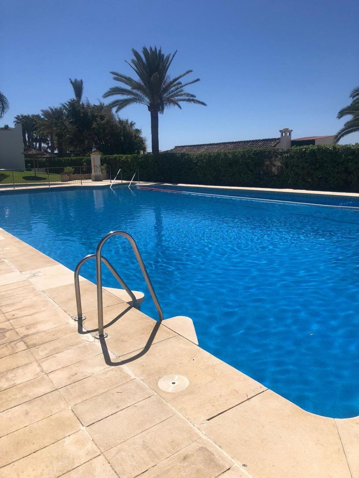 A Bright Townhouse In The Marbellamar Residential Development Marbella